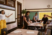 Students moving around a middle school math class