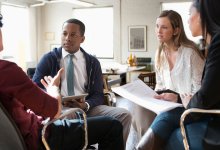 Teachers and a parent discuss a student’s Individualized Education Program.